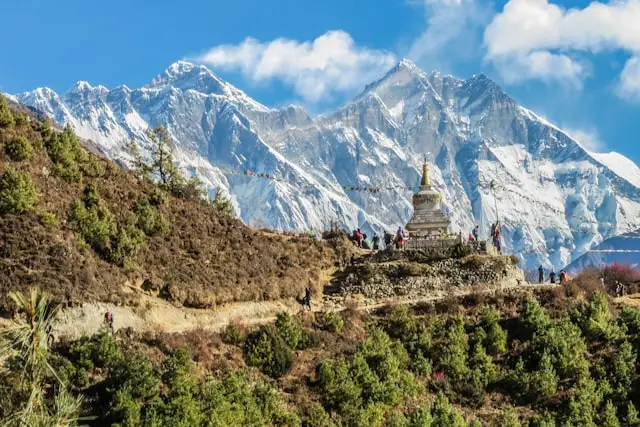 Stupa and prayer flags below Himalayan peaks